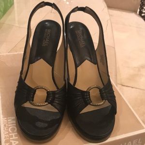 Sling back black leather wedges